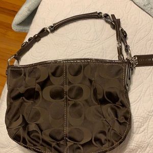 Barely used chocolate brown coach signature shoulder bag.